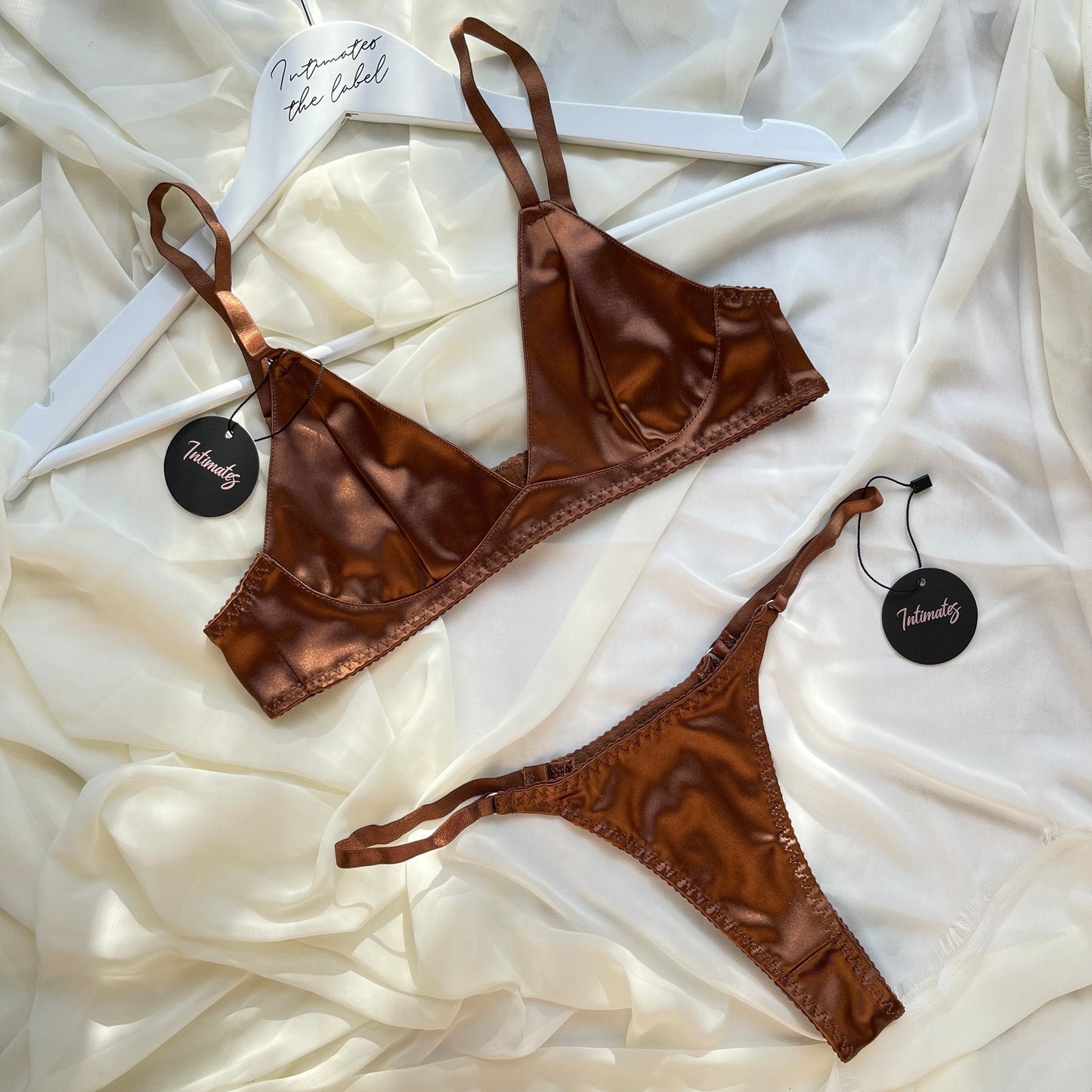 Undone Eternity Satin Bralette set displayed on a model, featuring smooth satin fabric and delicate straps.