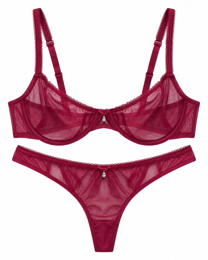 A two-piece lingerie set in deep burgundy red sheer mesh, featuring a bralette with adjustable straps and a matching thong, both with delicate lace trim and a small central decorative embellishment.
