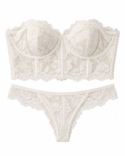 An ivory lace lingerie set featuring a strapless bandeau-style bra and matching thong, both with floral lace patterns and scalloped edges, displayed on a solid white background.