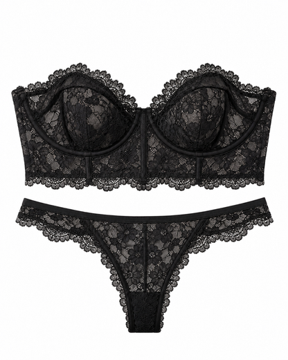 Black lace bralette and matching lace thong set with floral lace pattern and scalloped edges, displayed on a solid white background.