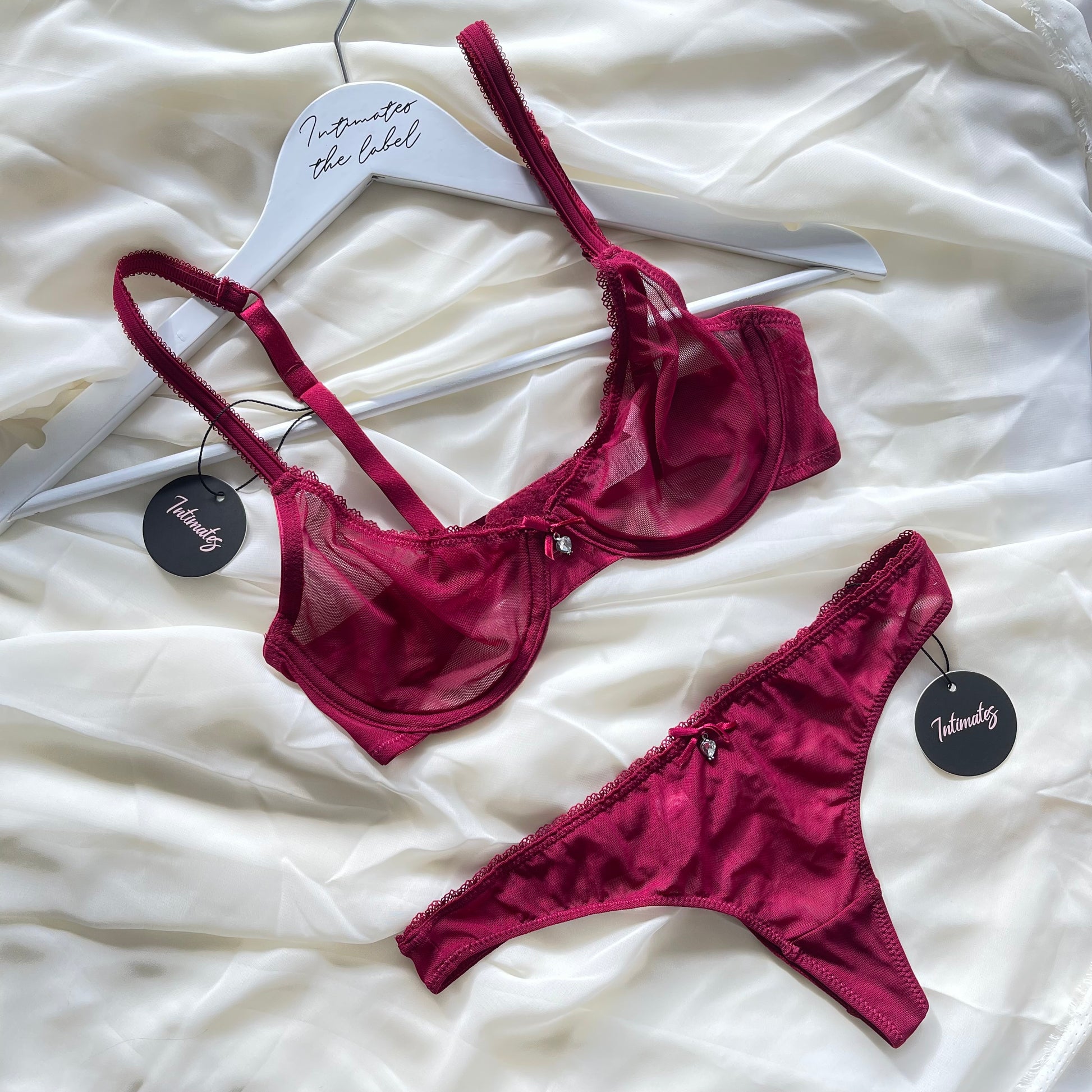 Red lingerie set on a white surface 