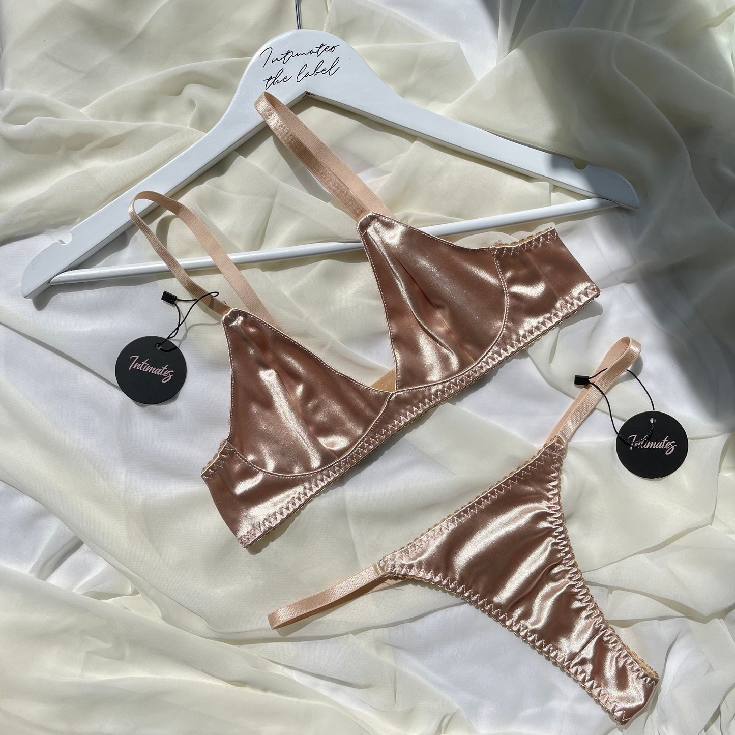 Undone Eternity Satin Bralette and matching underwear set in soft satin, featuring delicate straps and elegant design.