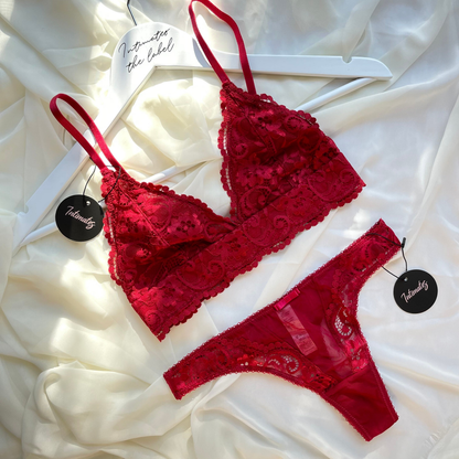 Undone wireless lace lingerie set in burgundy with delicate floral details, featuring a supportive bra and matching panties.