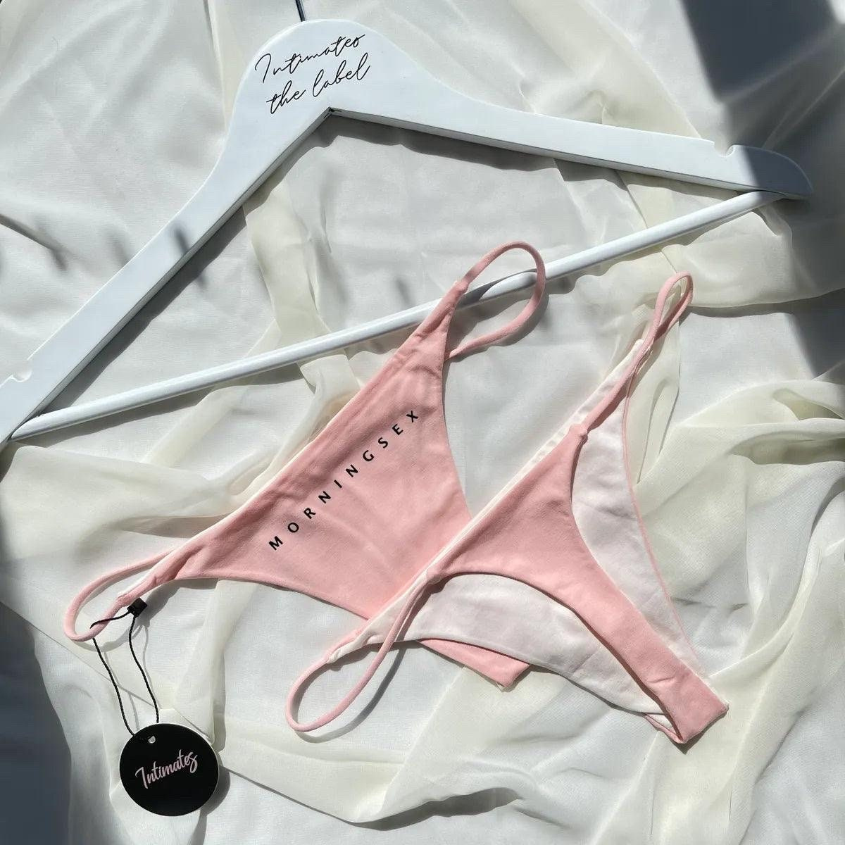 Pink cotton G-string thong from Undone with a Morning Sex design, featuring minimal coverage and comfortable fit.