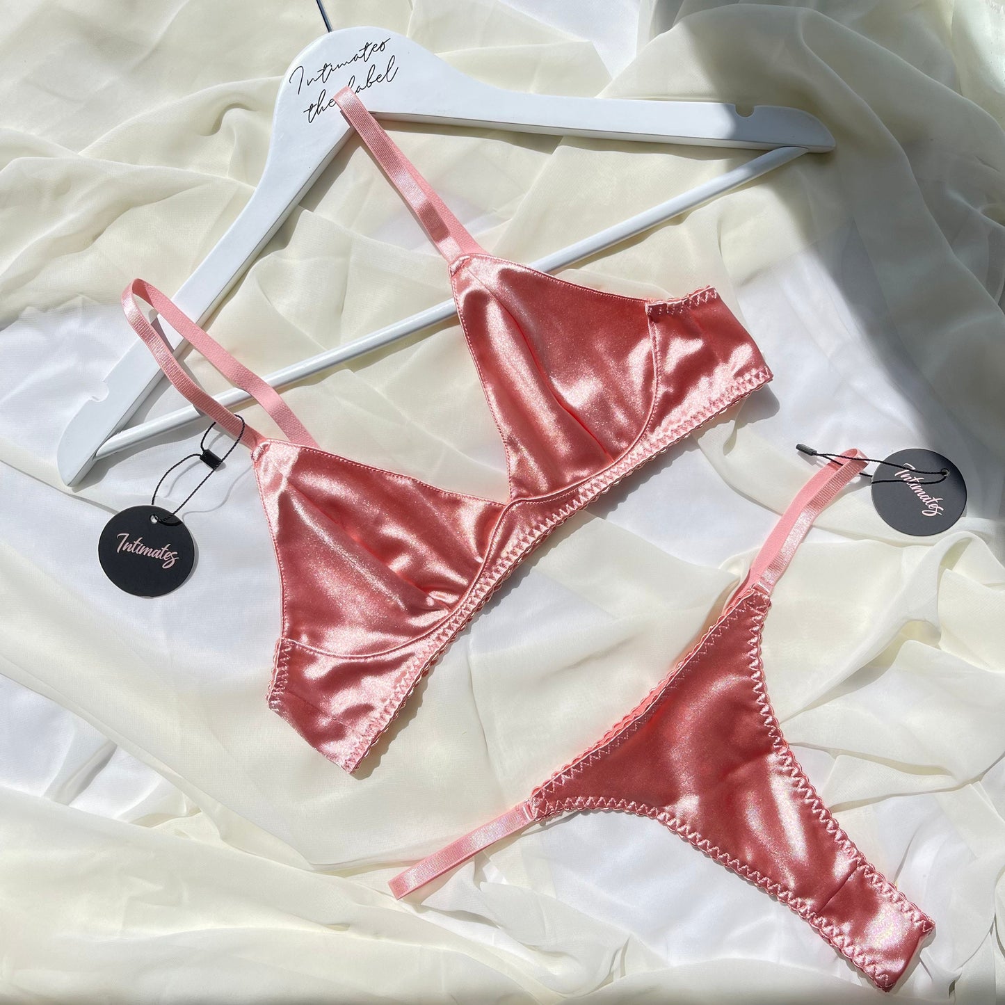 Undone Eternity Satin Bralette and matching underwear set in smooth satin fabric, featuring delicate straps and elegant design.