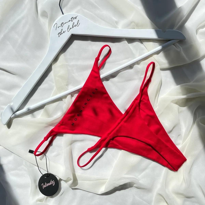 Red cotton G-string thong underwear from Undone, featuring minimal coverage and a sleek, comfortable design.