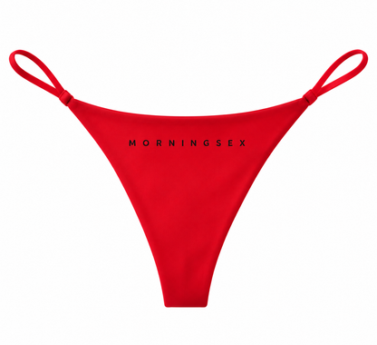 Red thong-style bikini bottom with thin side straps and black 'MORNINGSEX' text printed across the front, shown on a plain white background.