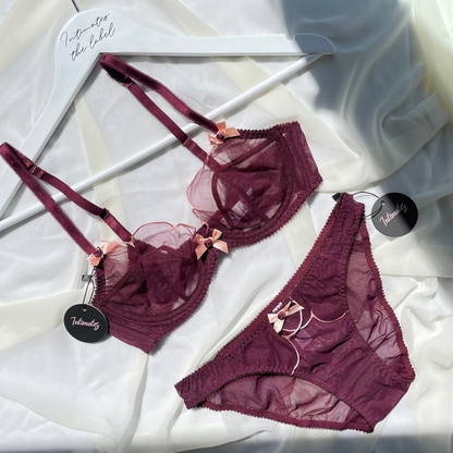 Undone luxury minimal sheer black lingerie set featuring delicate lace details and a sleek, elegant design.