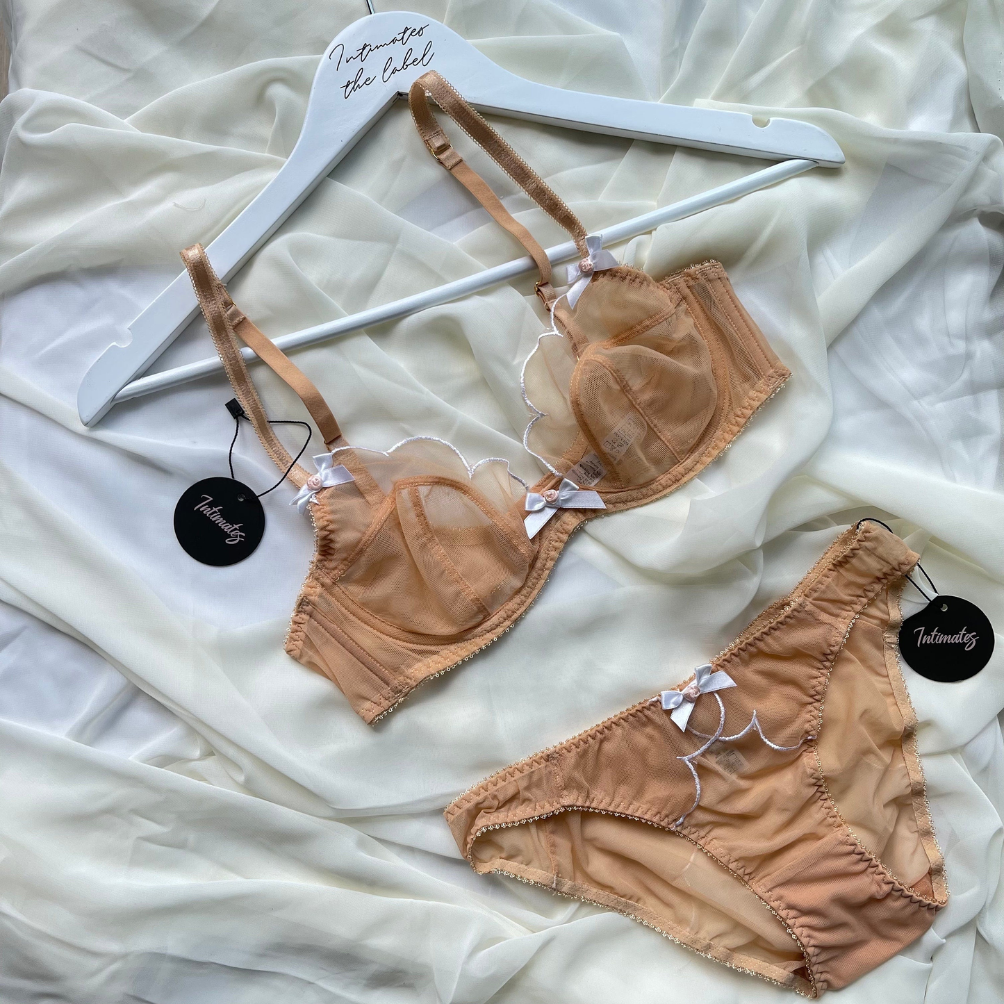 Undone luxury minimal sheer black lingerie set with delicate straps and subtle design, perfect for elegant intimate wear.