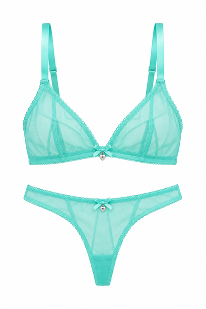 A two-piece sheer lingerie set in mint green, featuring a bra and matching thong with lace trim and a small central bow detail, displayed on a solid white background.