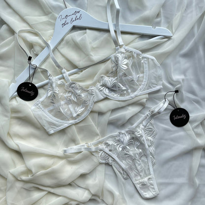 White floral embroidery lingerie set by Undone featuring delicate lace and intricate embroidery for a feminine look.
