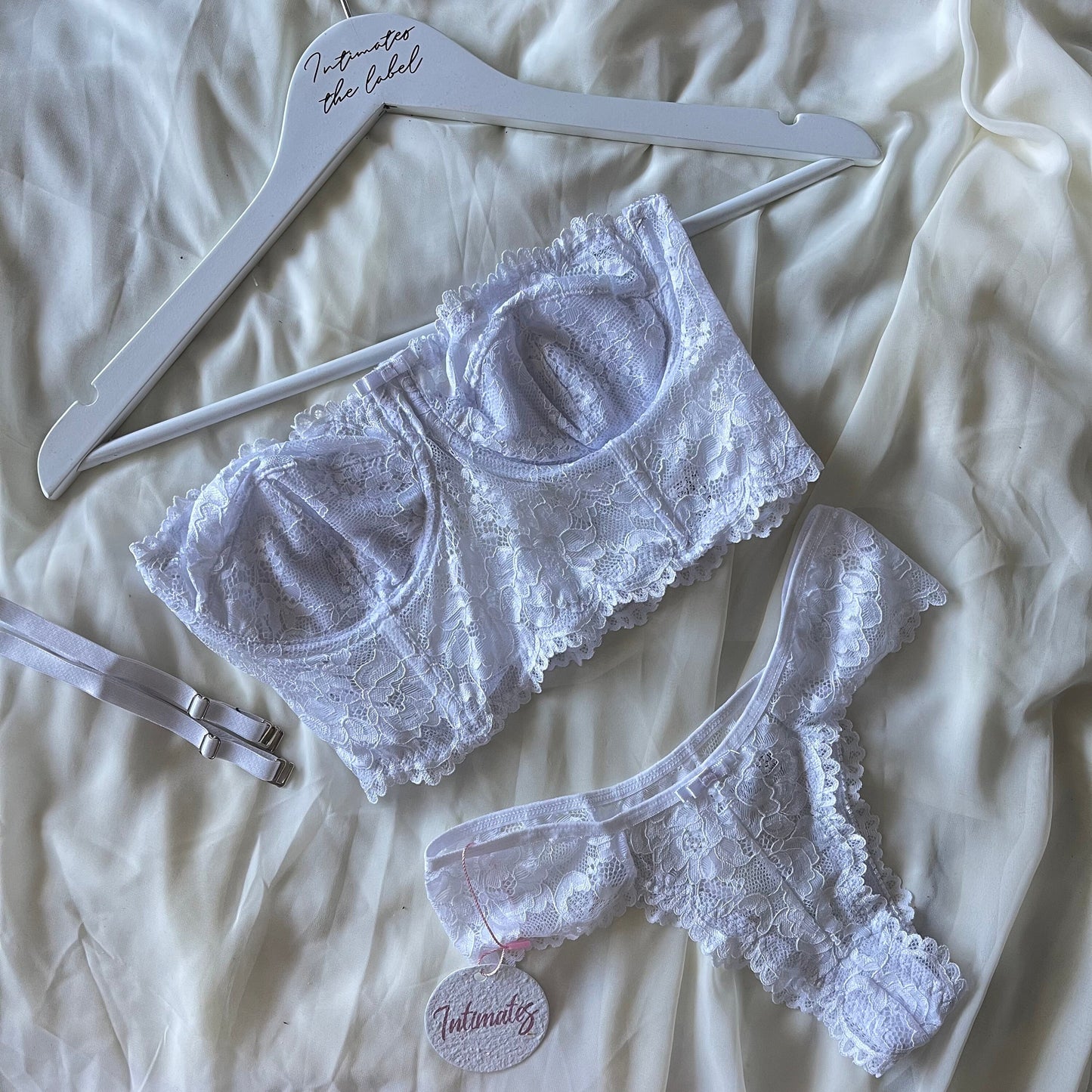 Undone Sweet Bodylace lingerie set featuring delicate lace bra and matching panties, soft pastel pink color, front view.